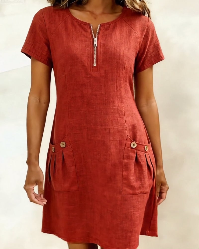 Remi pink shift dress front view showing button-trim pleated front pockets
