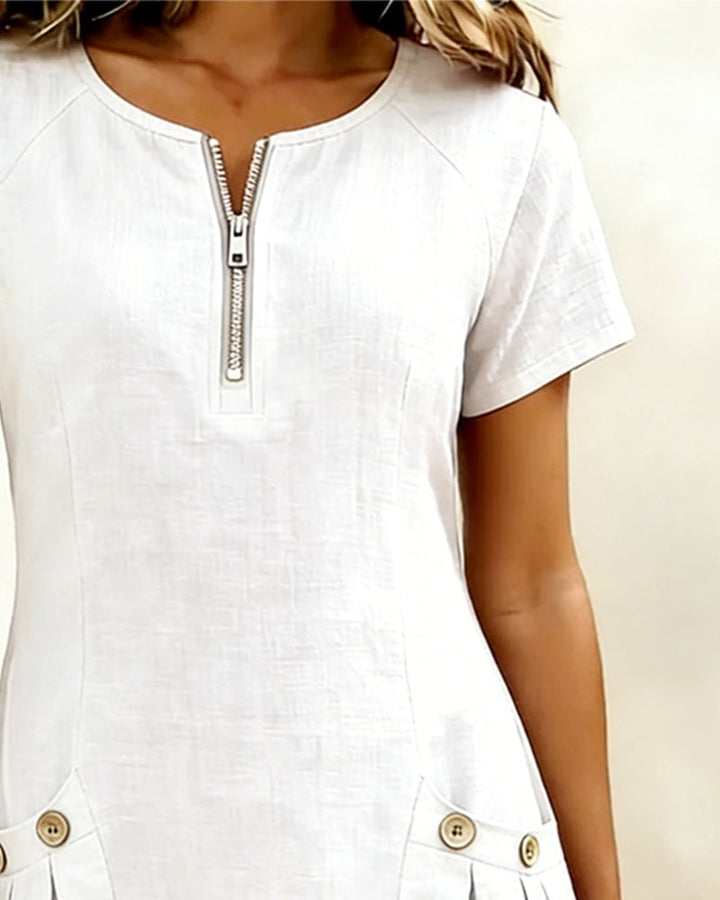 Remi blue short-sleeve dress showing neat sleeve cut and round zip neckline