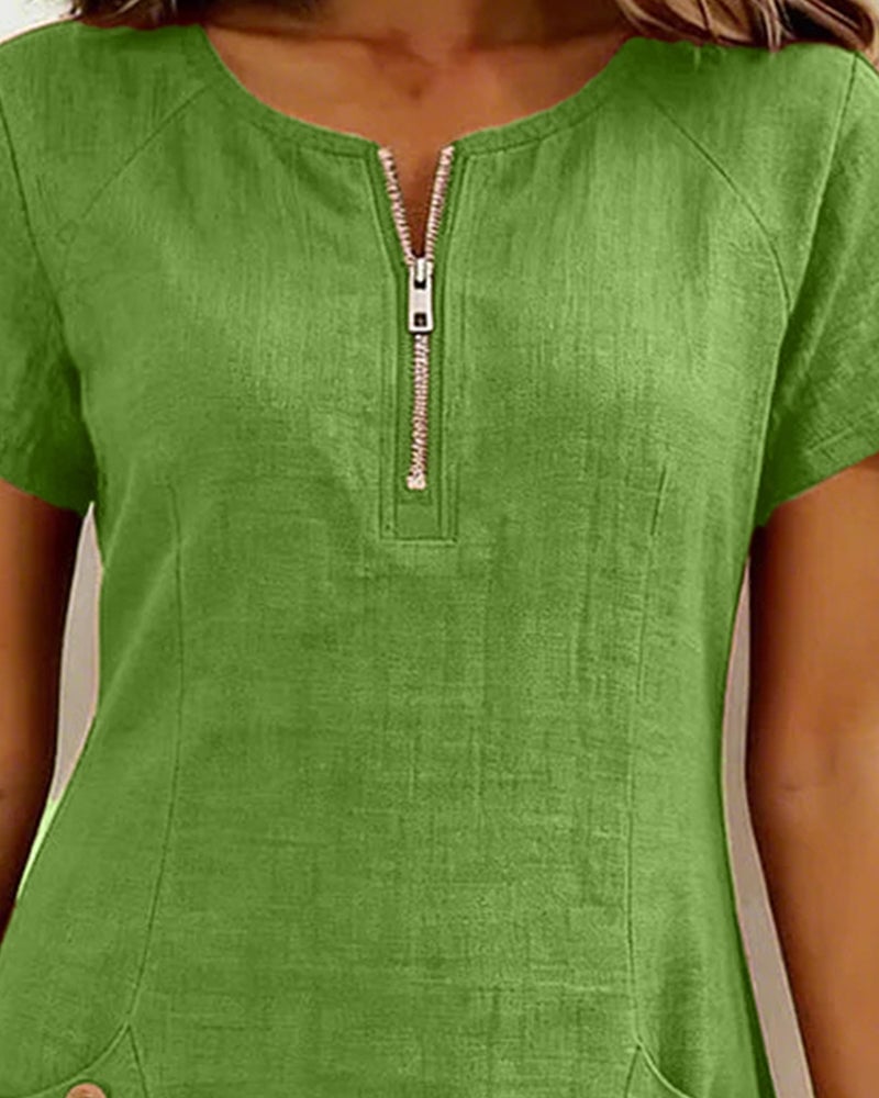 Close-up of silver zip closure at neckline on the Remi red dress