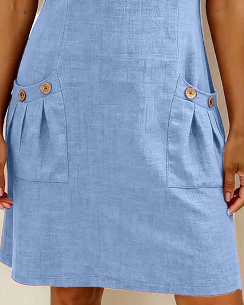 Remi green shift dress close-up showing fabric texture and button pocket detail