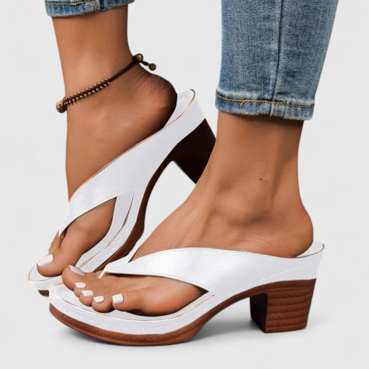Close-up of Remy sandal stacked wood-effect block heel and platform base in black with contrast sole