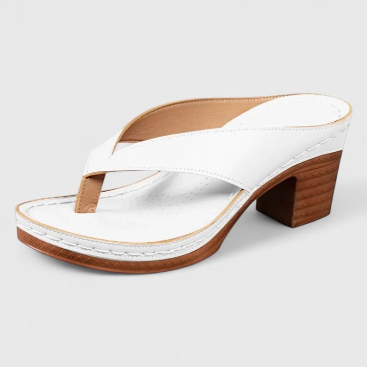 Flat lay of all four Remy block heel thong sandal colorways — black, brown, gold, and white