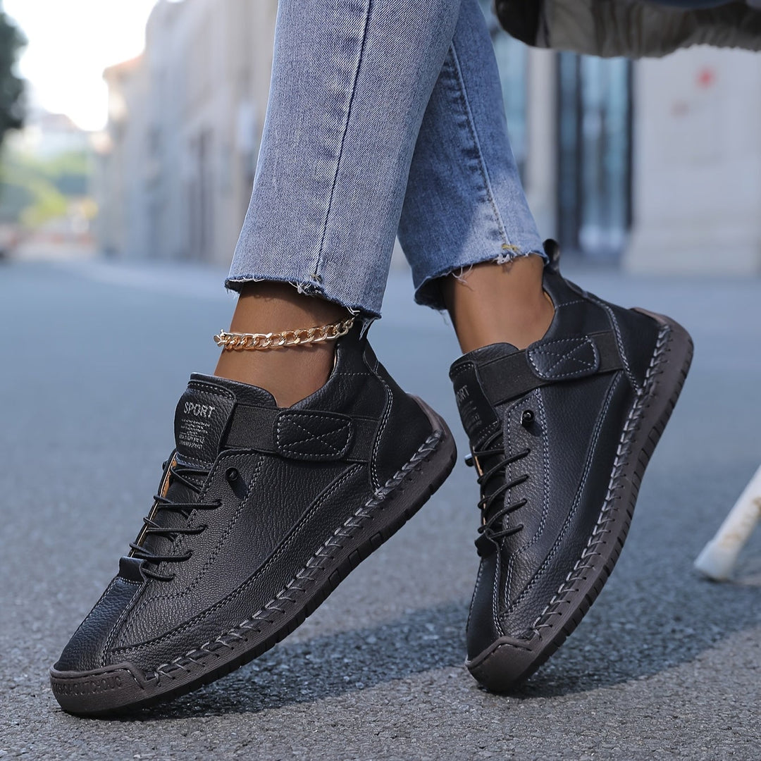 Close-up of Renée sneaker Stability+ sole showing impact-absorbing orthopedic construction
