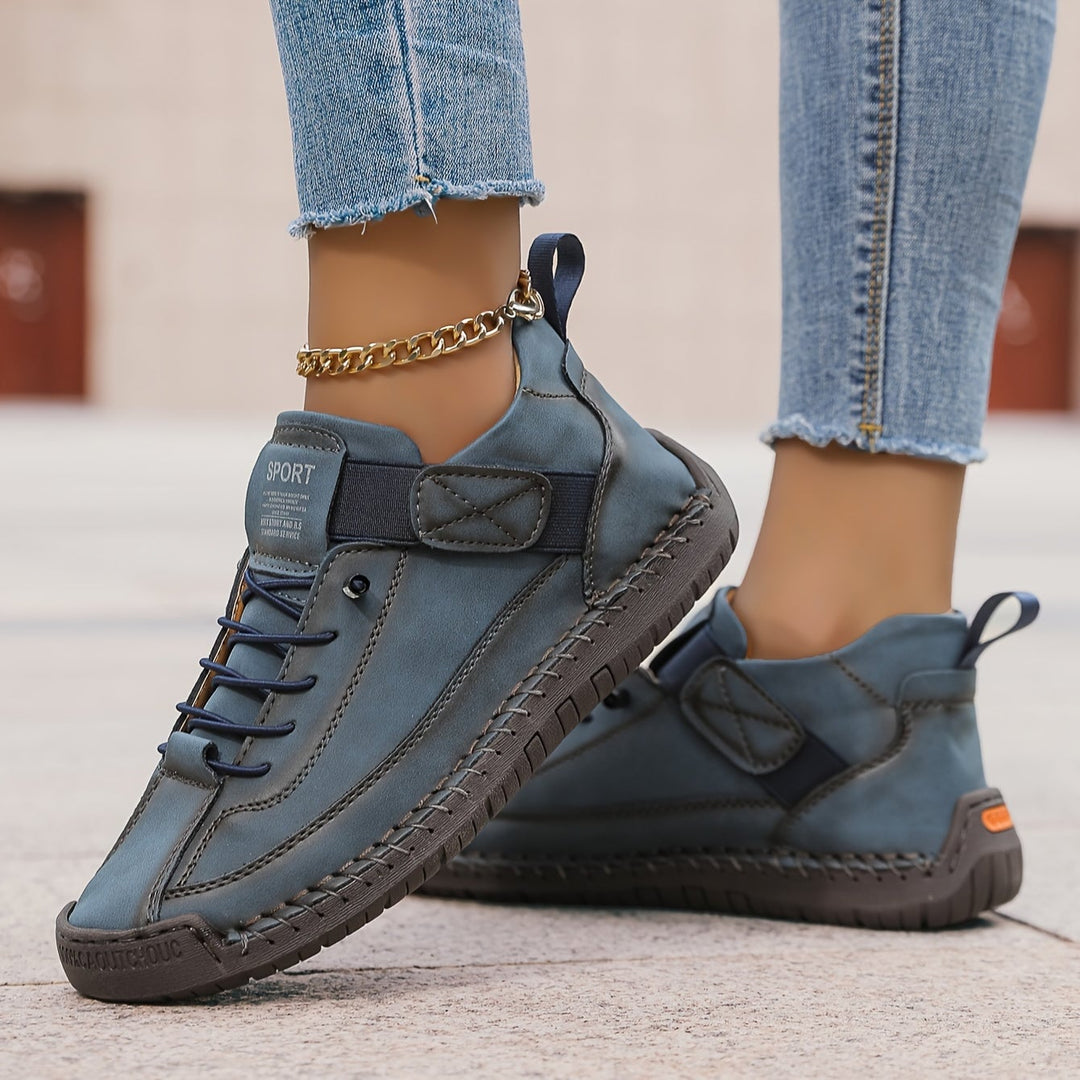 Renée sneakers in Forest Brown showing adjustable velcro strap detail