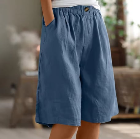 Renee Comfort Shorts in beige styled with a white tank top for a casual summer look