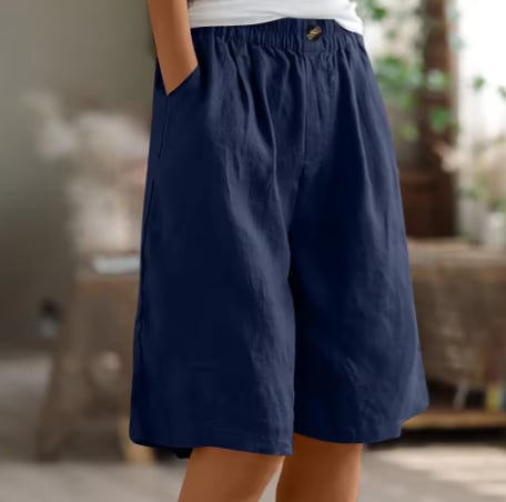 Model wearing Renee Comfort Shorts in pink with a relaxed blouse