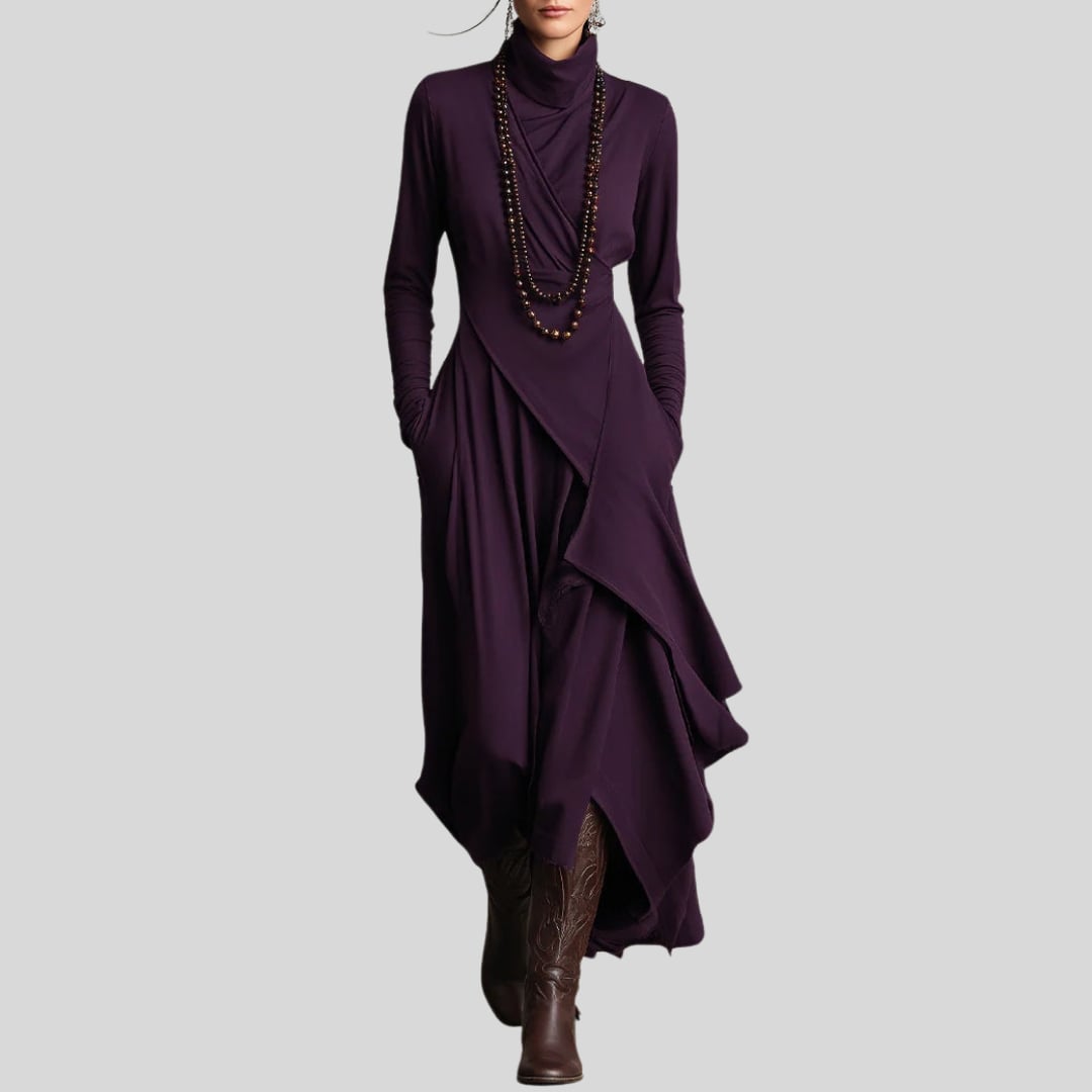 Model wearing the Rhea elegant maxi dress in green, showing the full-length flowing silhouette