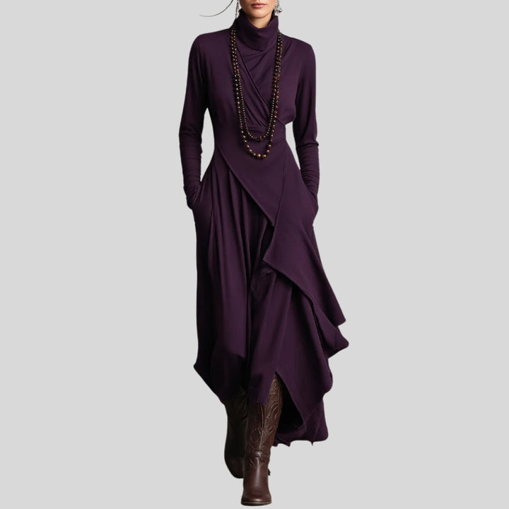 Model wearing the Rhea elegant maxi dress in green, showing the full-length flowing silhouette