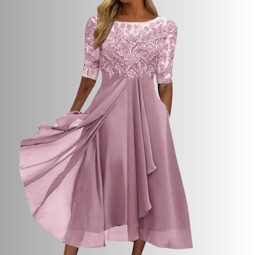 Front view of the Rhonda elegant lace dress in pink showing the flattering tailored silhouette