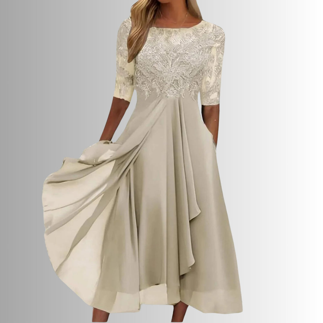 Close-up of the delicate lace bodice detail on the Rhonda elegant lace dress in cream
