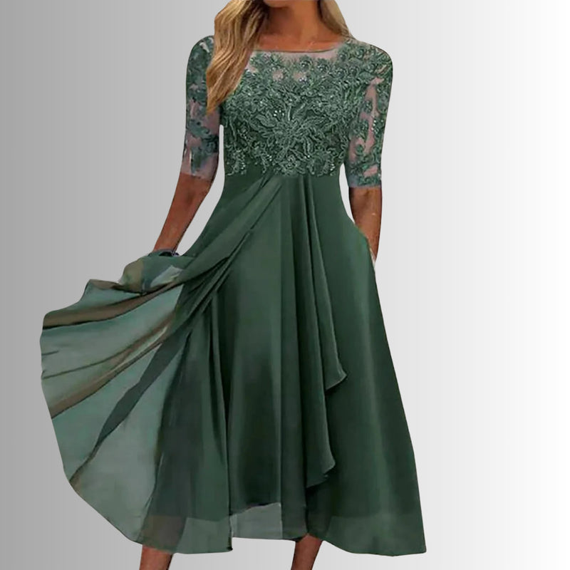 Side view of the Rhonda elegant lace dress in green highlighting the feather-light layered skirt