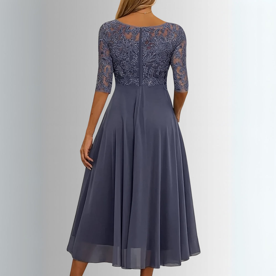 Model styling the Rhonda elegant lace dress for a wedding guest occasion