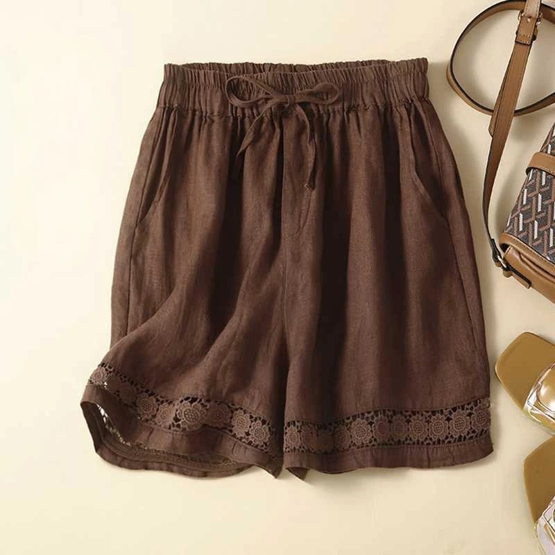 Florimay relaxed floral shorts laid flat showing roomy silhouette and embroidered trim detail