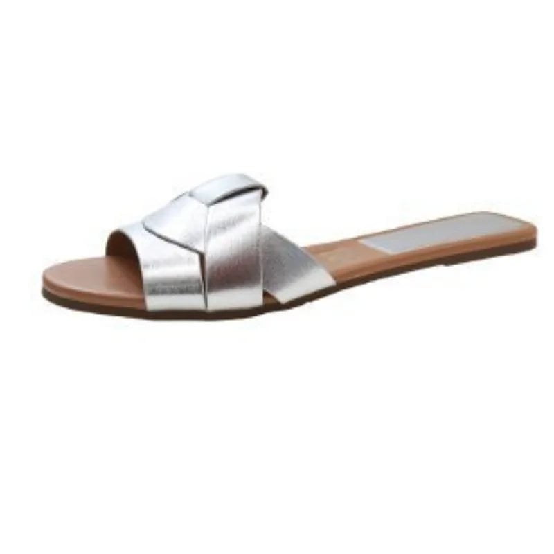 Close-up of the Ridge slide's padded insole and smooth upper strap in silver