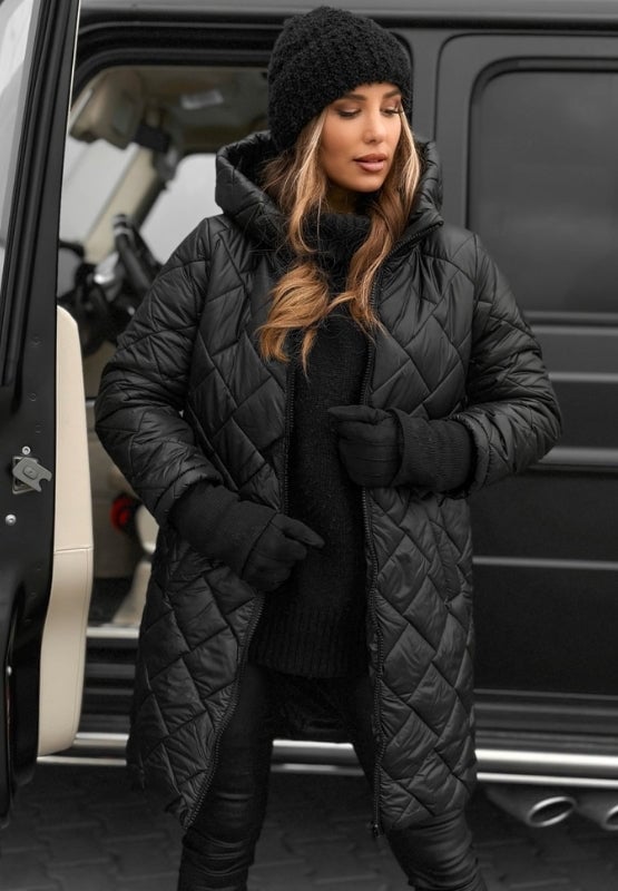 Front view of the Riley quilted coat in black showing streamlined seam details