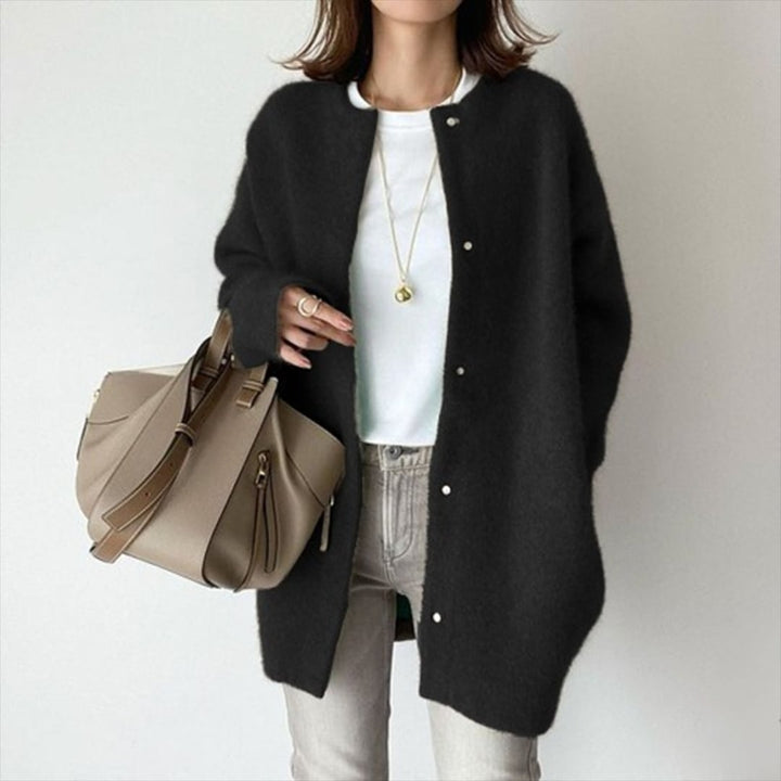 Riley layered cardigan in black showing structured dimensional layers and elegant fit