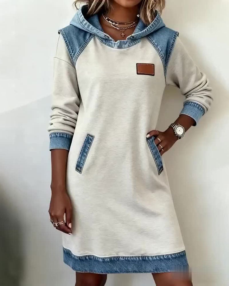 Model wearing the Rina denim dress in white styled with casual sneakers