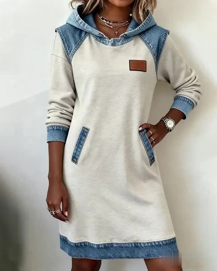 Model wearing the Rina denim dress in white styled with casual sneakers
