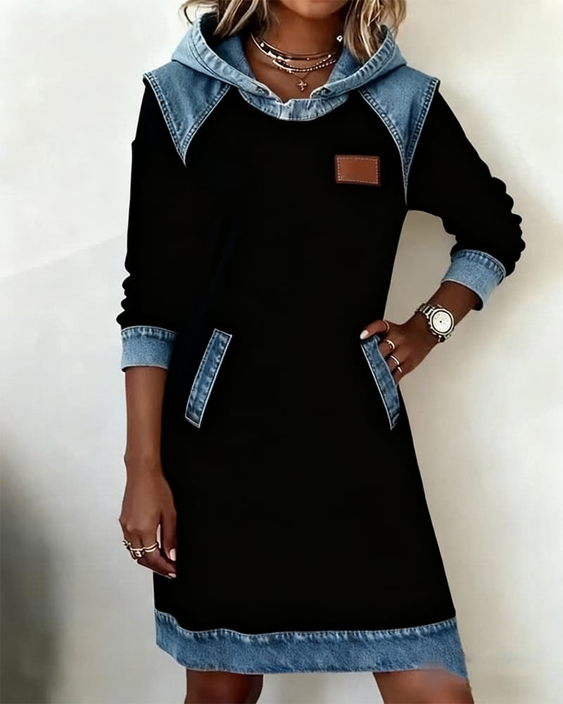 Side profile of the Rina denim dress highlighting the curved silhouette