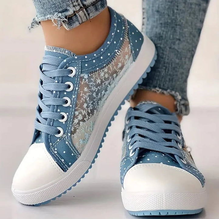 Side profile of light blue women's orthopedic sneakers showing arch support structure