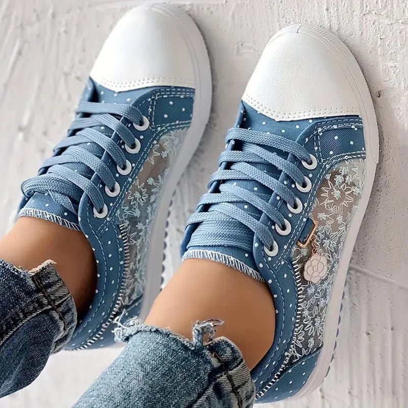 Dark blue orthopedic comfort sneakers for women on a clean white background