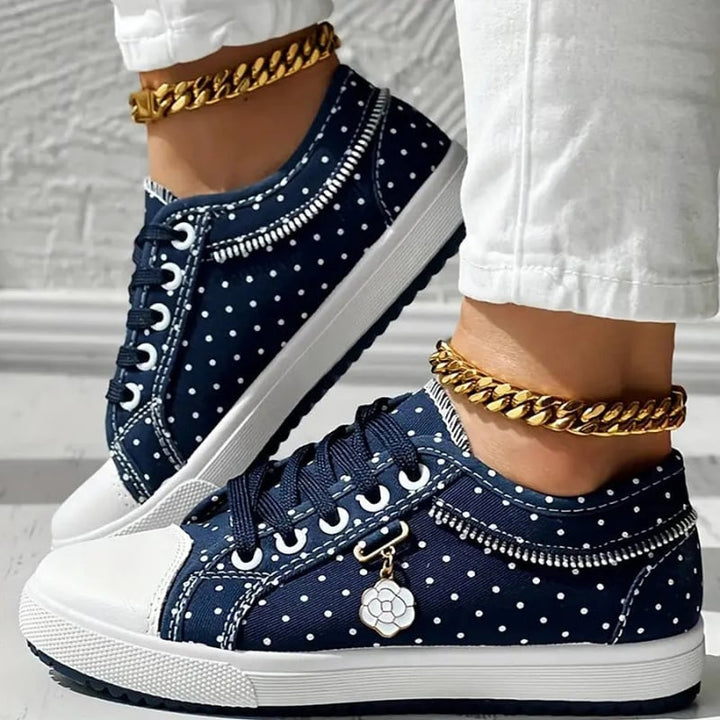 Navy orthopedic sneakers for women displayed at a slight angle on white background