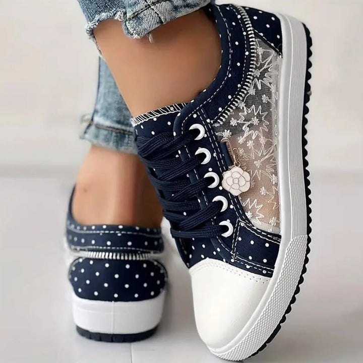 Pair of sky blue orthopedic sneakers shown from the front on a neutral background