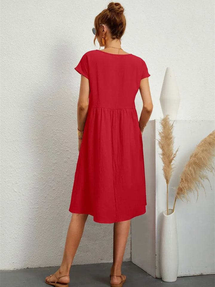 Close-up of casual pocket dress showing side pocket detail and soft, airy fabric drape