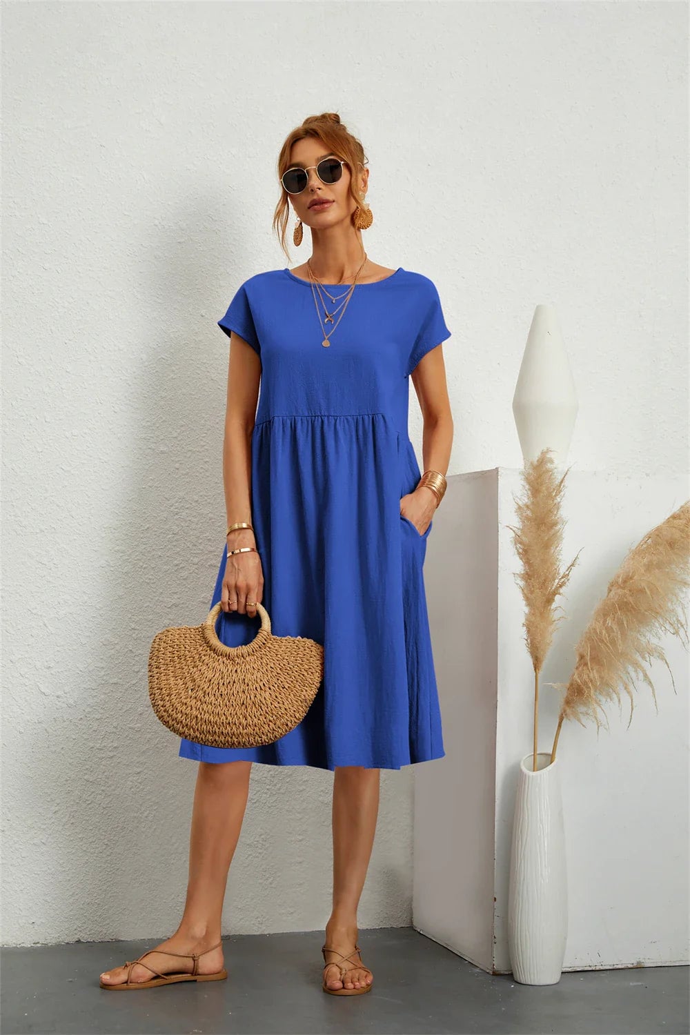 Front view of casual pocket dress on model, showcasing the relaxed neckline and easy-wear design