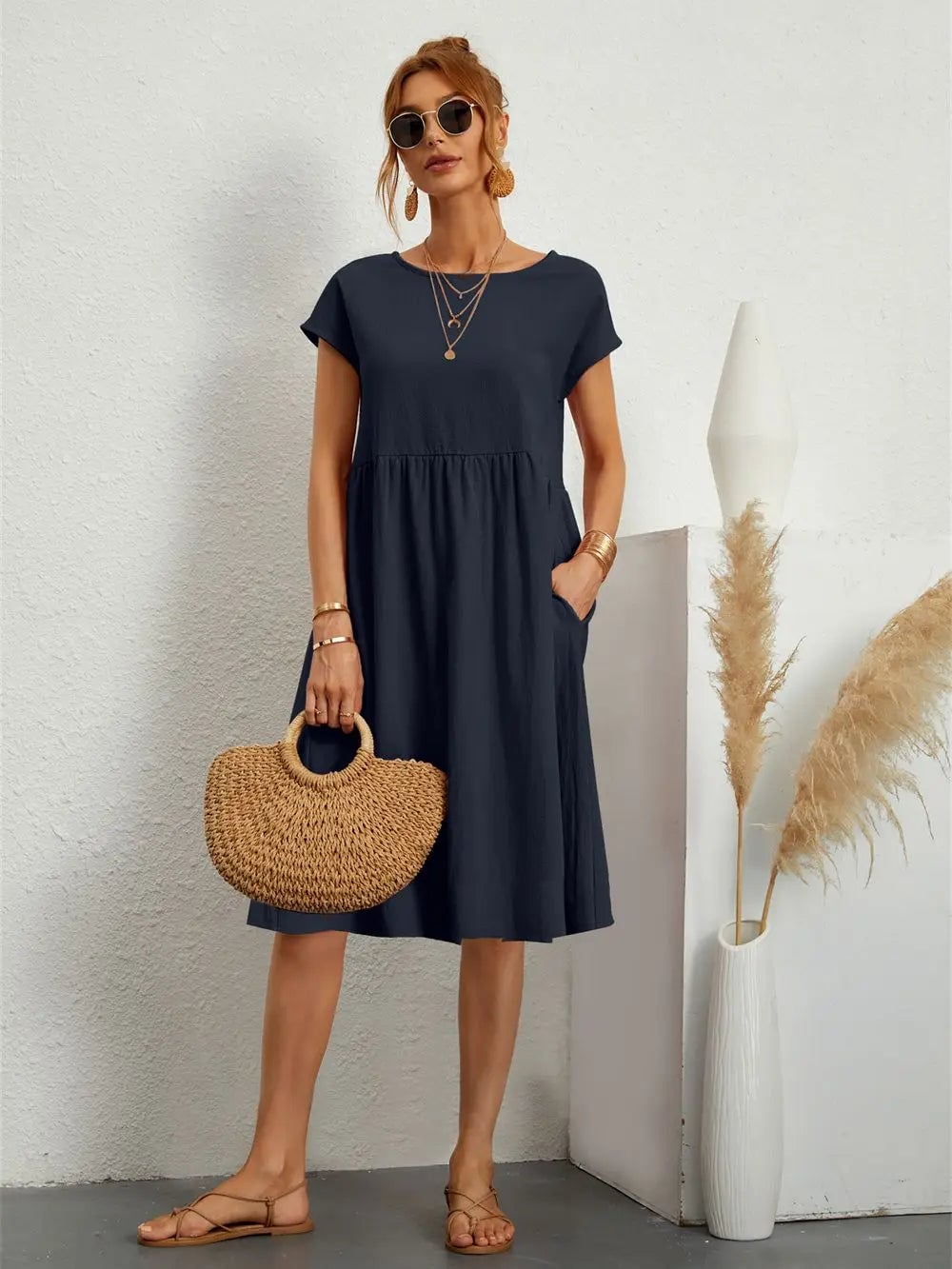 Model in casual pocket dress paired with sneakers for a laid-back everyday look