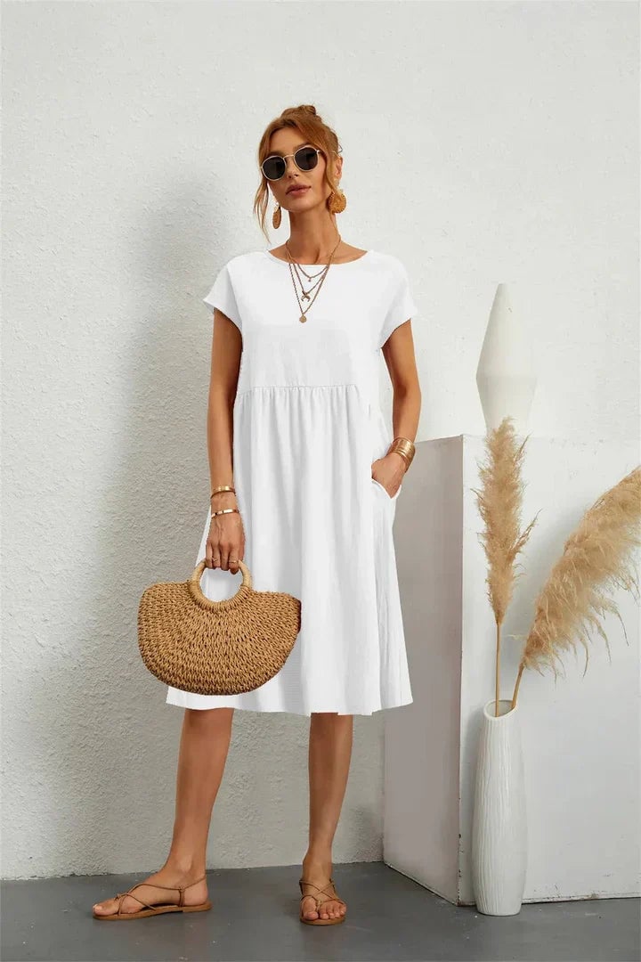 Detail shot of casual pocket dress fabric and fit, highlighting the soft airy blend and comfortable drape