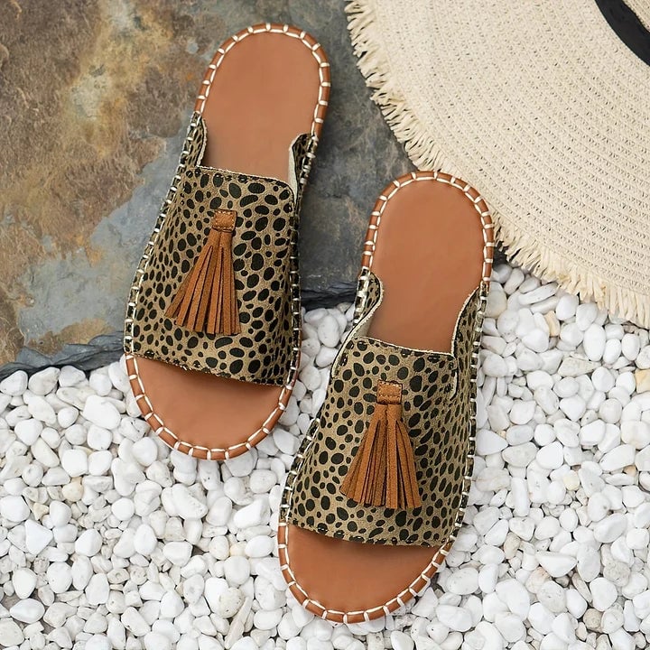 Robin flat sandals worn on feet, casual outdoor setting