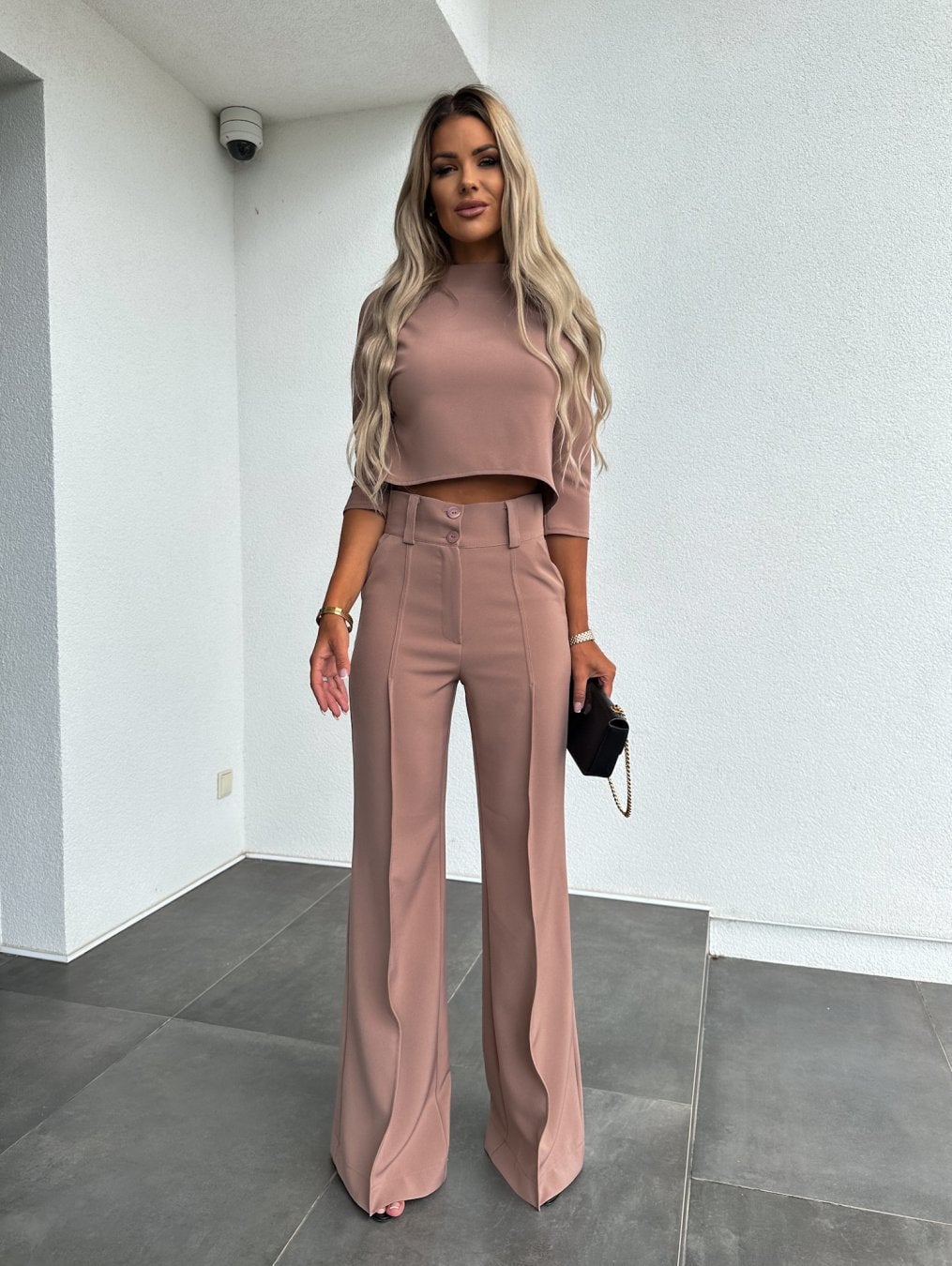 Close-up of the soft breathable fabric on the pink two-piece lounge set top