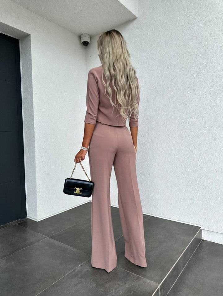 Side view of the white high-waisted lounge pants highlighting the sculpted fit