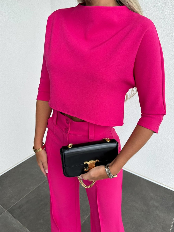 Full-body front view of the pink two-piece lounge set on a model in size L