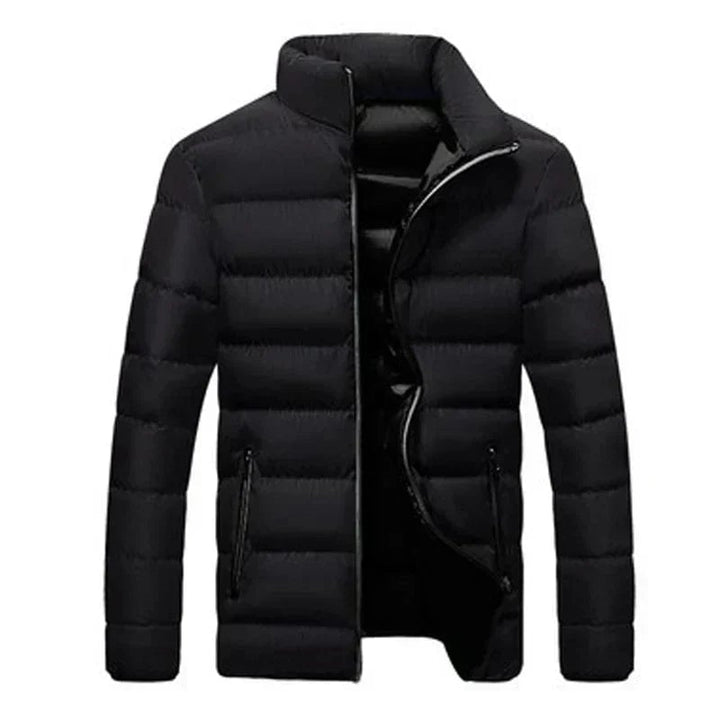 Front view of the elegant thermal jacket in Black with a clean tailored silhouette and zippered pockets