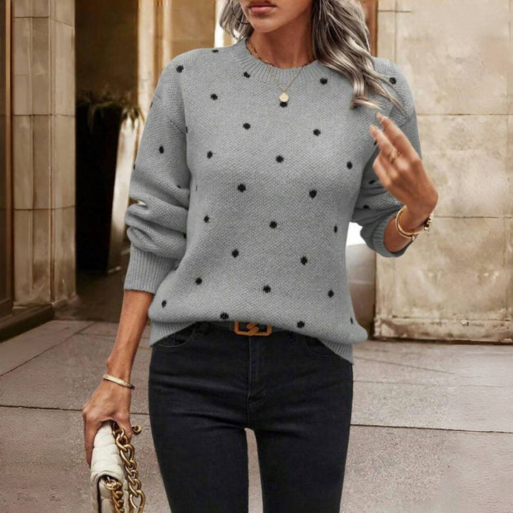 Full-length view of the Cozy Dot Sweater styled with jeans, highlighting its flattering relaxed silhouette