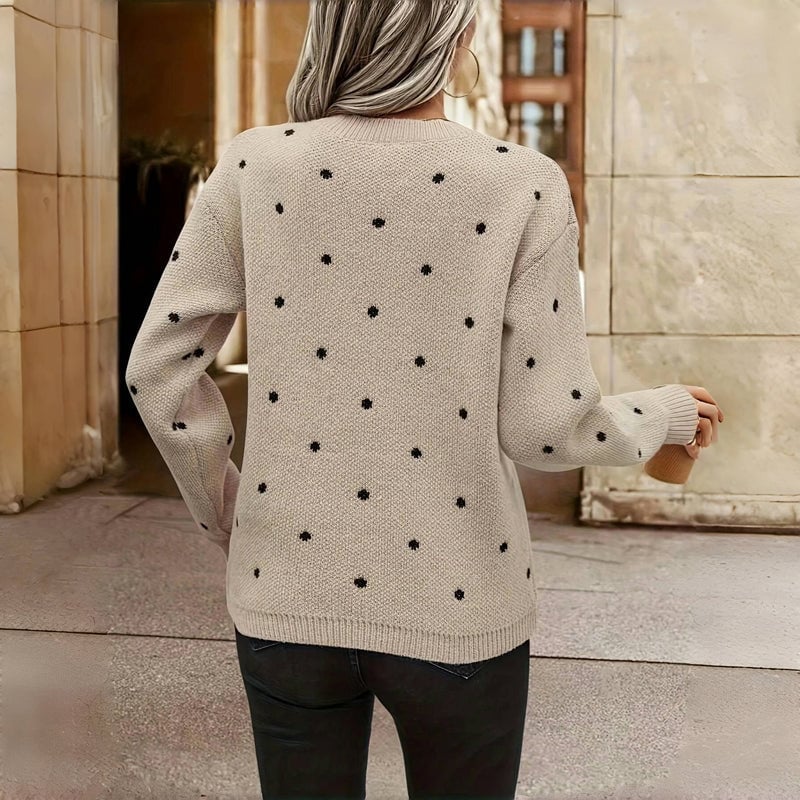 Model layering the Cozy Dot Sweater over a dress for an elevated, polished outfit