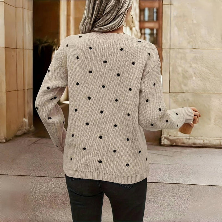 Model layering the Cozy Dot Sweater over a dress for an elevated, polished outfit