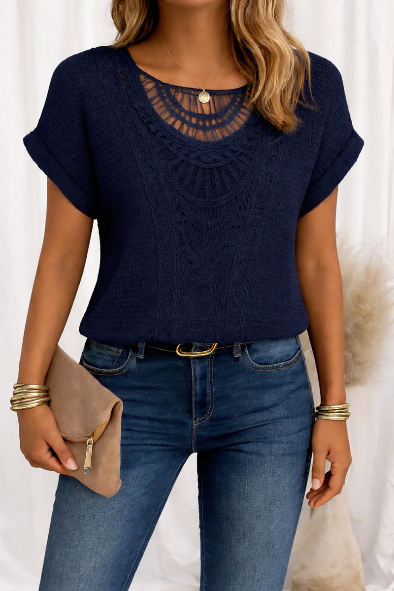 Front view of a feminine short-sleeve lace trim top styled with casual bottoms