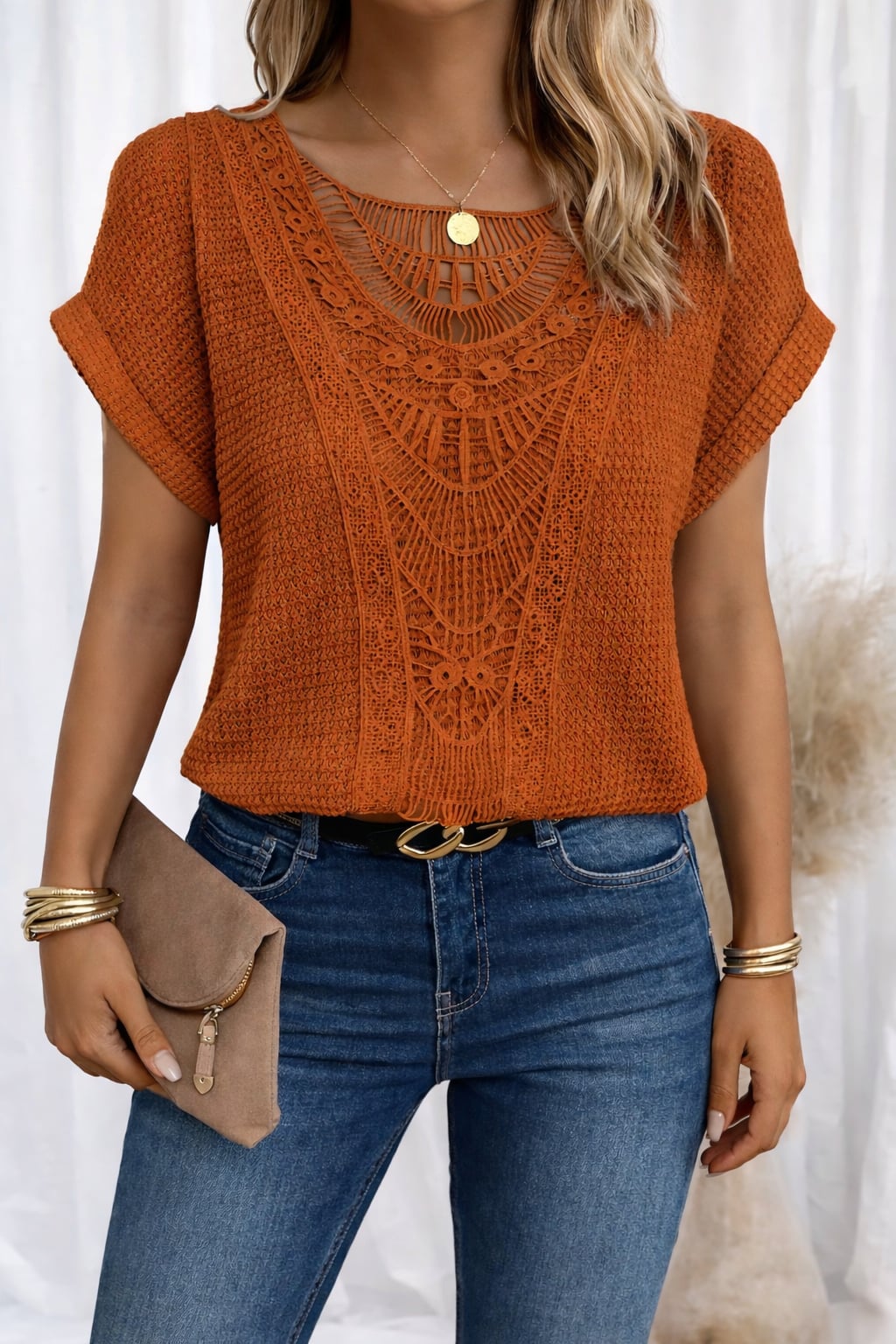 Close-up of delicate lace neckline detail on a soft round neck top