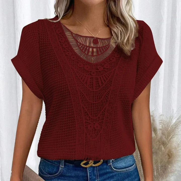 Pink version of the lace trim short-sleeve top styled for a casual daytime look