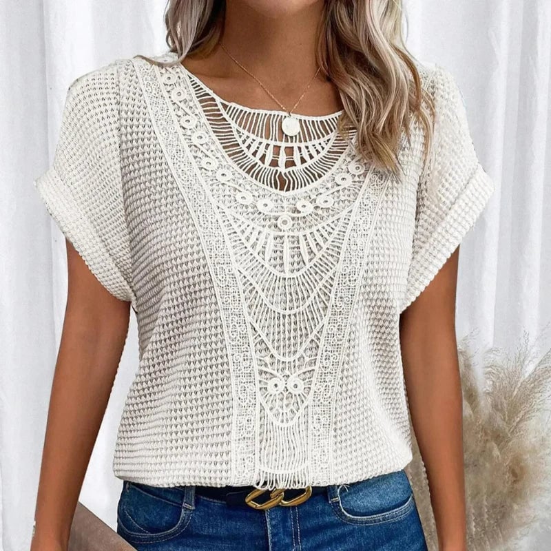 Gray lace trim top on a model showing the soft structure and short sleeve coverage