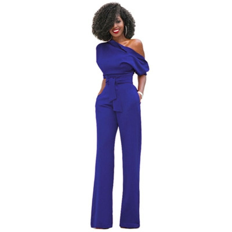 Side view of the Rosa wide-leg jumpsuit highlighting the elongating floor-grazing trouser silhouette