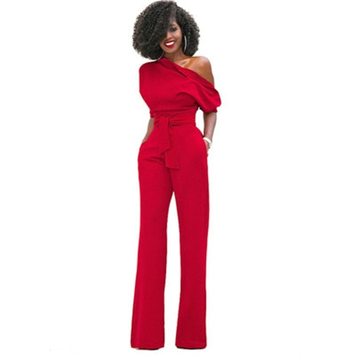 Close-up of the gathered puff sleeve detail and off-shoulder neckline on the Rosa formal jumpsuit