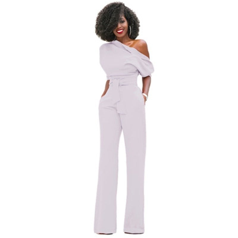 Close-up of the matching self-tie fabric waist belt on the Rosa wide-leg jumpsuit