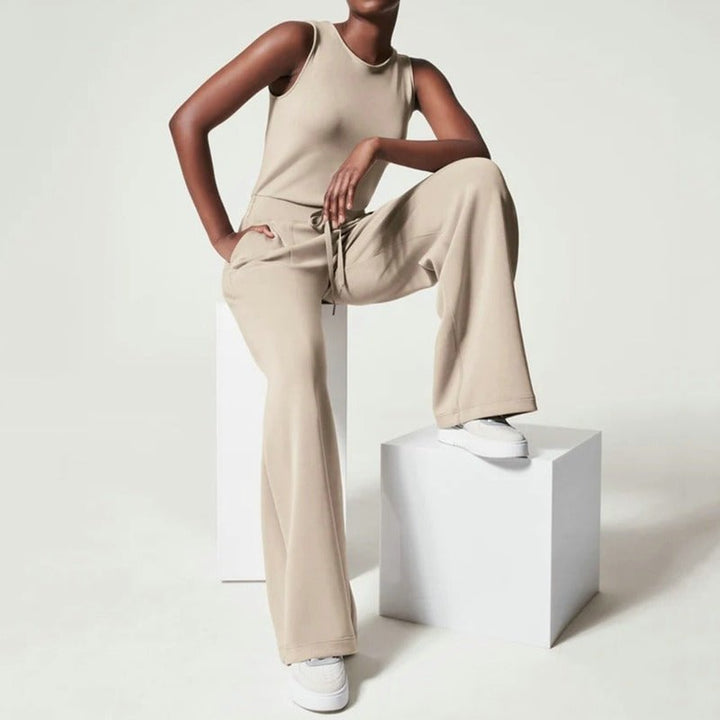 Front view of the Rosalie wide-leg jumpsuit in dark green showing the high-waisted silhouette and flowing wide-leg cut