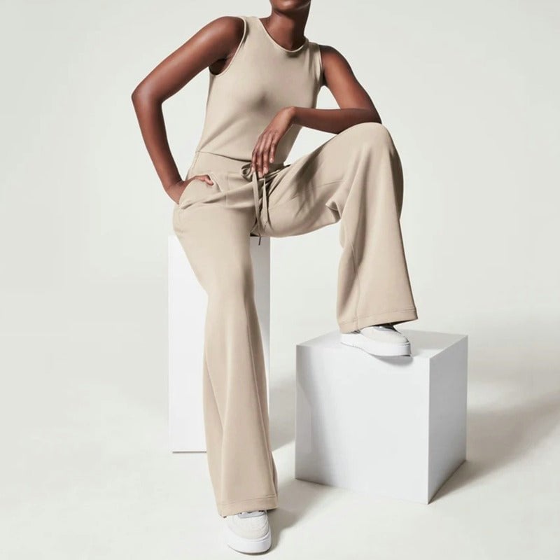 Front view of the Rosalie wide-leg jumpsuit in dark green showing the high-waisted silhouette and flowing wide-leg cut