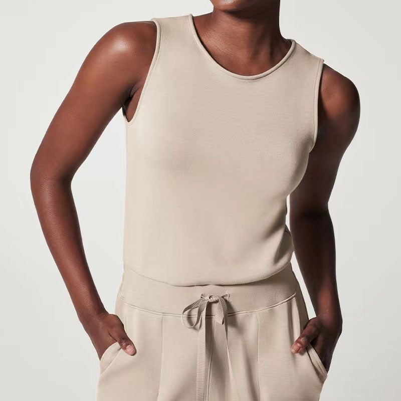 Close-up of the adjustable waist tie detail on the Rosalie sleeveless jumpsuit in black