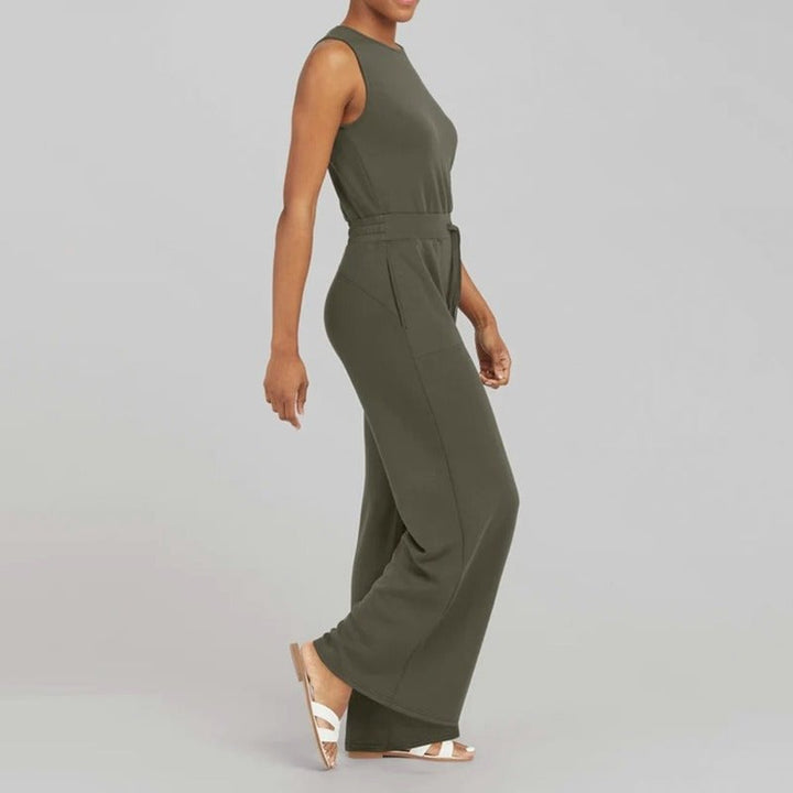 Detail shot of the lightweight breathable fabric of the Rosalie wide-leg jumpsuit in blue